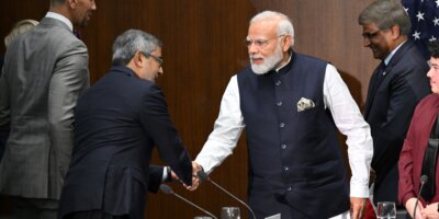 India's Prime Minister Narendra Modi shakes hands with Micron Technology CEO Sanjay Mehrotra during a visit to the National Science Foundation in Alexandria, Virginia, on June 21, 2023. (Photo by Mandel NGAN / AFP).