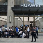 Sales of Huawei smartphones in China grew 37% YoY, commanding a 12.9% market share in the quarter while Apple declined. Photo: People queue up for hours outside Huaweis flagship store in Shanghai on September 25, 2023, hoping to be able to buy the tech giant's latest Mate 60 Pro mobile phone. (Photo by REBECCA BAILEY / AFP)