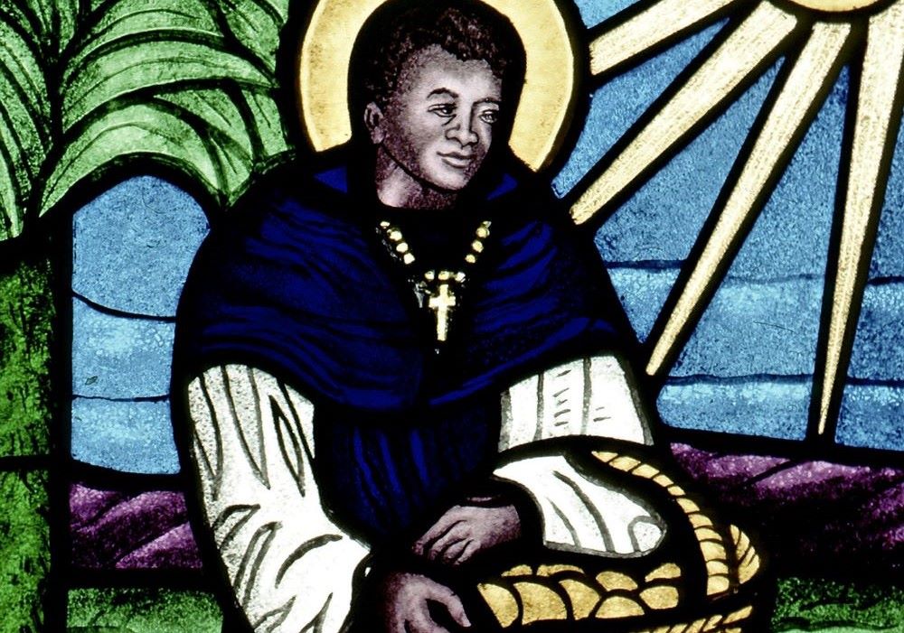 St. Martin de Porres is depicted in a stained glass window. St. Martin de Porres is depicted in a stained glass window.