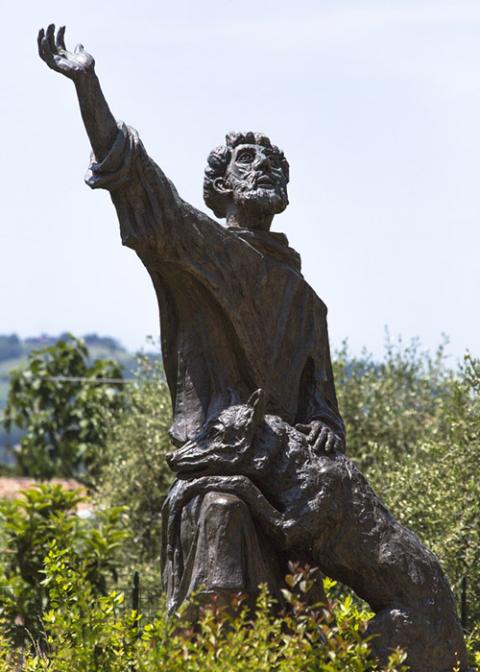 A statue of St. Francis of Assisi and a wolf is seen May 30 in the town of Gubbio, Italy. (CNS/Octavio Duran)