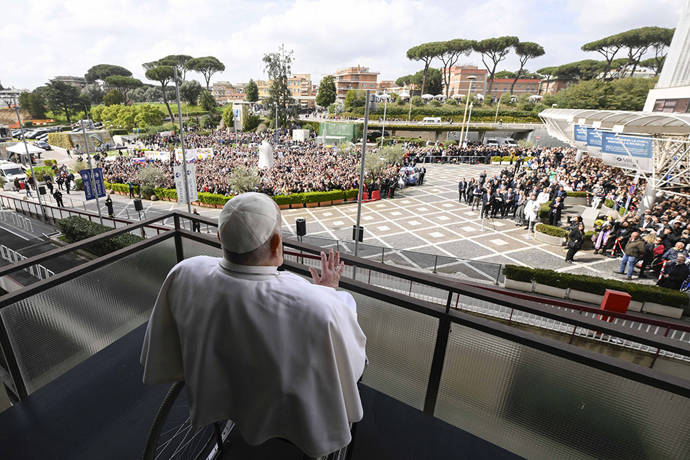 Pope Francis greets well-wishers at Rome's Gemelli hospital before returning to the Vatican March 23, 2025, after 38 days of treatment at the hospital. (CNS/Vatican Media)
