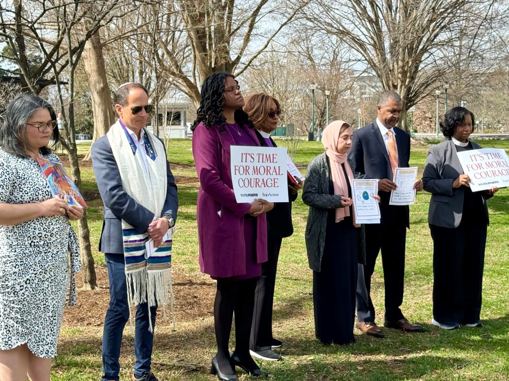 Speakers at the Faithful Witness Wednesday vigil at the U.S. Capitol on March 19 join in prayer.