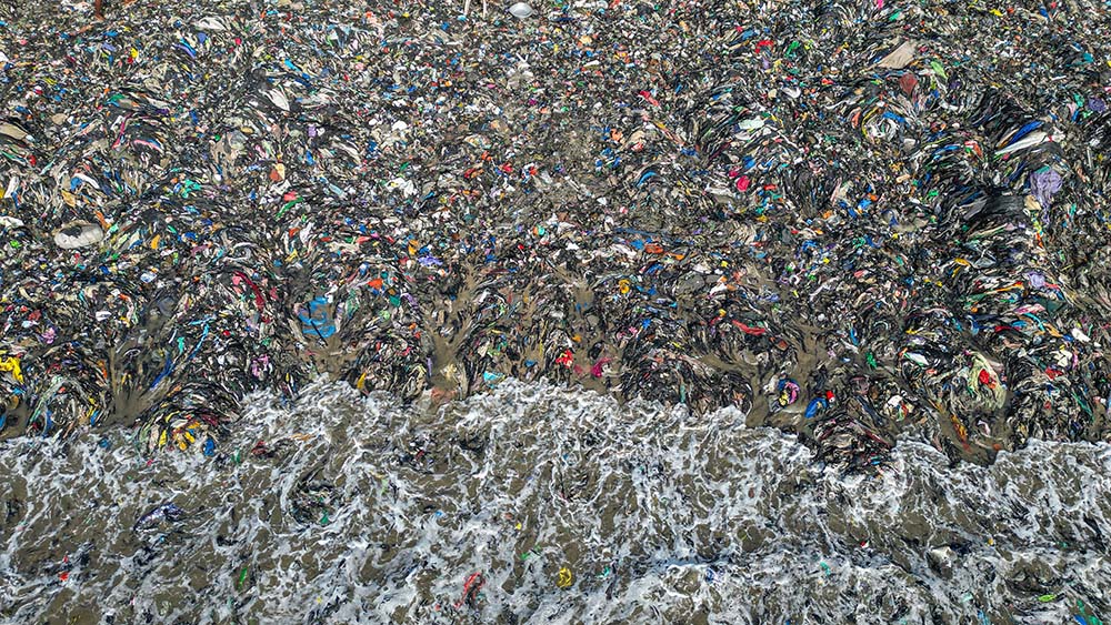 Textile waste pollutes the beach shore at Jamestown in Accra, Ghana, Oct. 19, 2024. (AP/Misper Apawu)