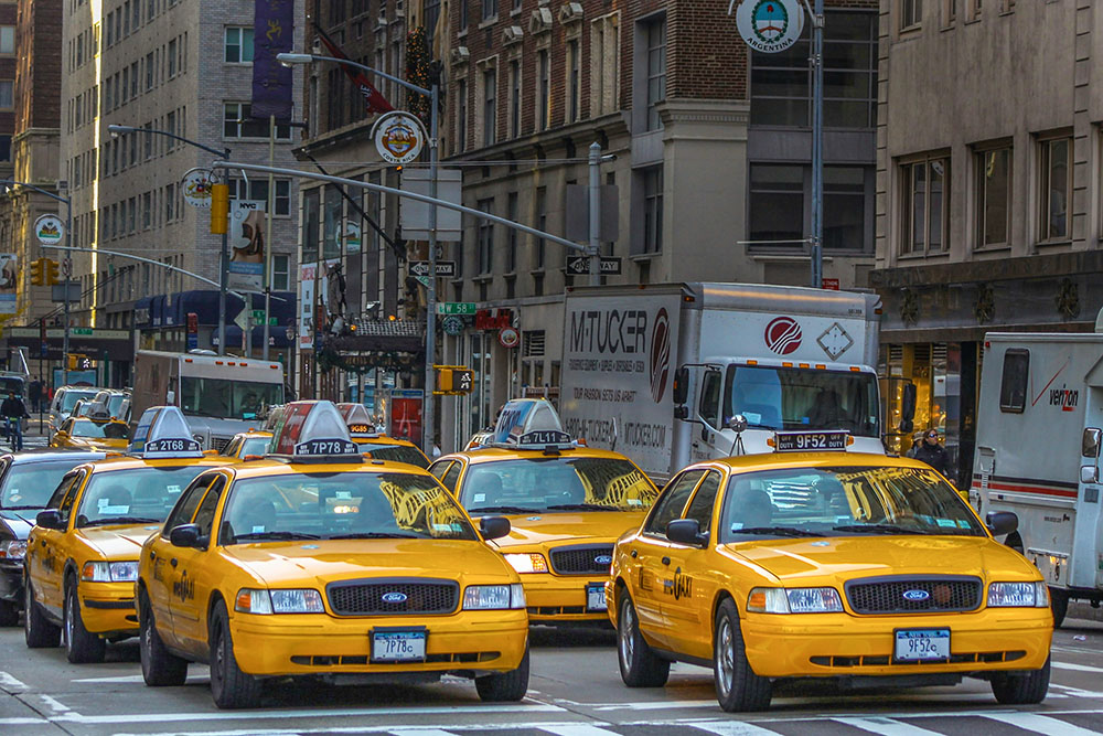 Yellow taxi cabs in New York City (Unsplash/Nick Fewings)