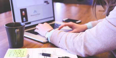 woman using laptop tech