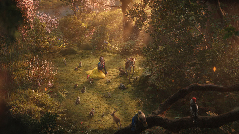 Snow White (Rachel Zegler) finds an antidote to the kingdom's scarcity in the mystery and possibility of the forest. (Disney)