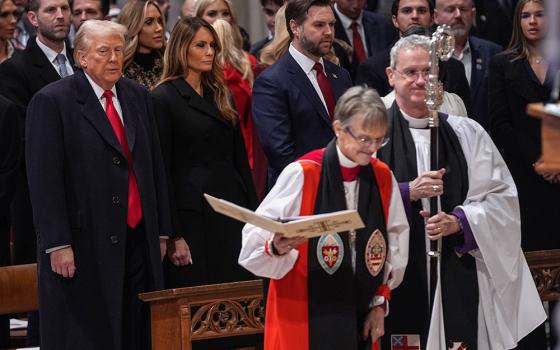 President Donald Trump, left, watches as Bishop Mariann Budde arrives at the national prayer service at the Washington National Cathedral Jan. 21, 2025, in Washington, D.C. (AP/Evan Vucci)
