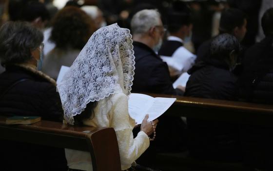 A faithful reads during a Latin Mass at Rome's ancient Pantheon basilica, in Rome, Italy on Oct. 29, 2021. (AP/Luca Bruno)
