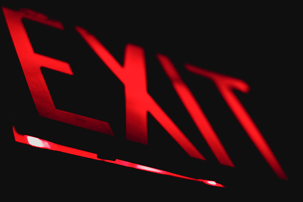 Red lighted exit sign (Unsplash/Wes Branch)